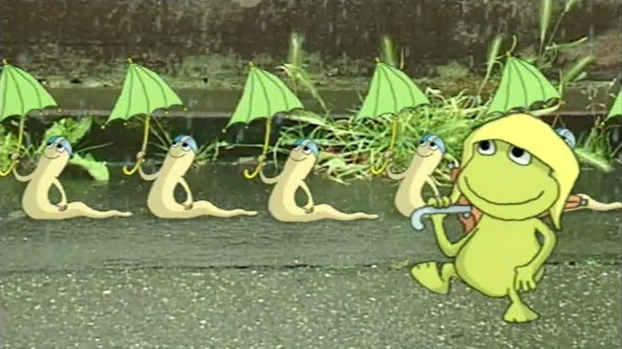 Ein Frosch und mehrere Wurme mir Regenschirm